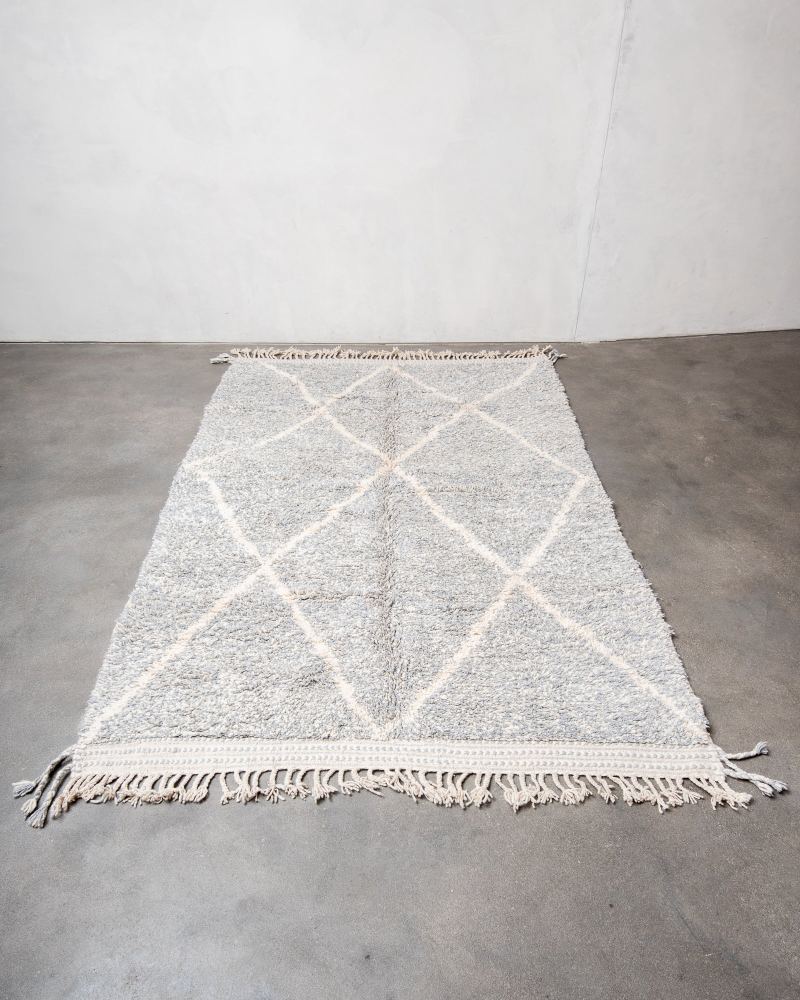 Modern, designer, handcrafted Berber rug from Morocco. Beniourain carpet with beautiful colours and patterns and fluffy wool texture.